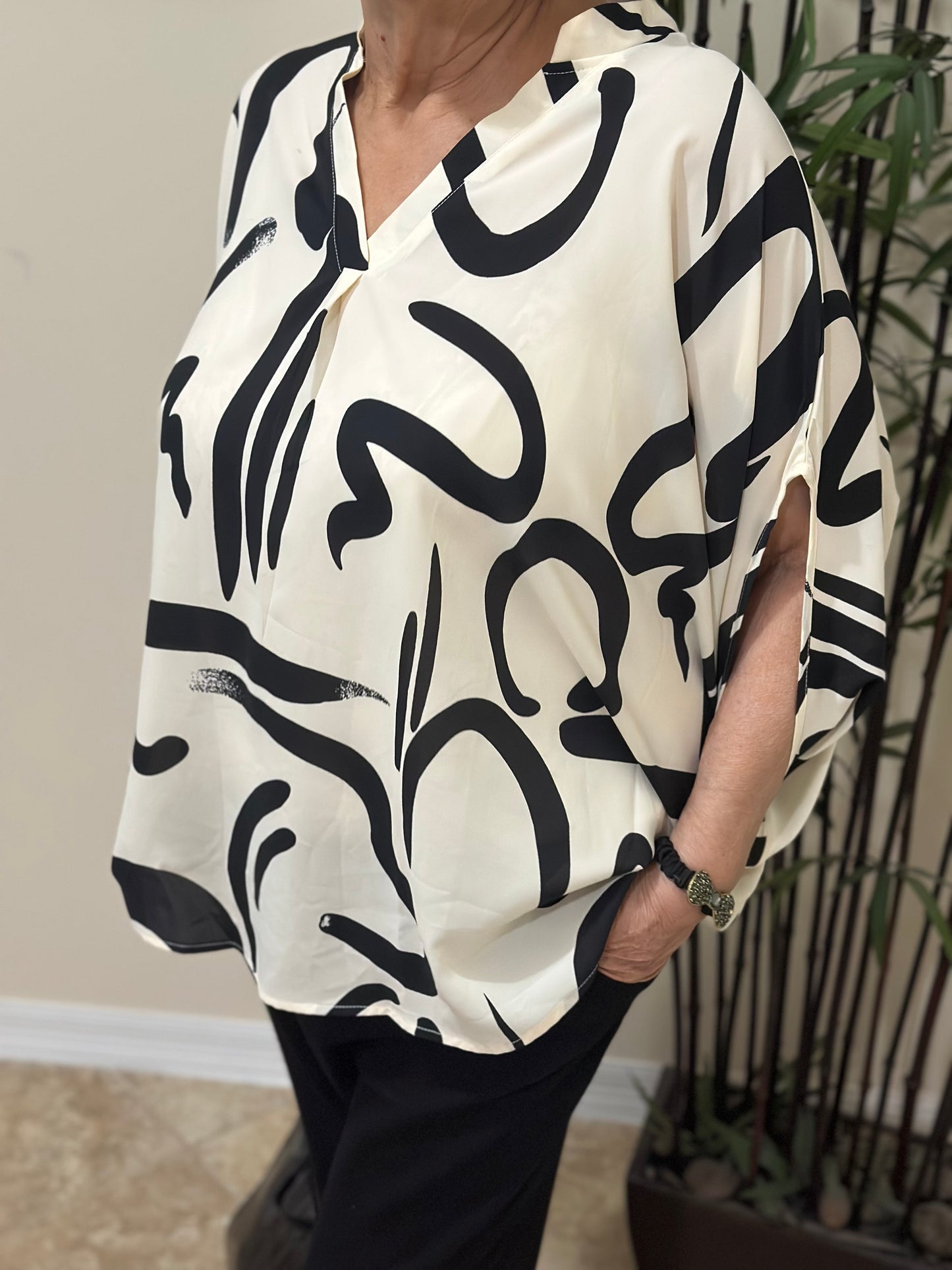 Perfee Printed Notched Half Sleeve Blouse
